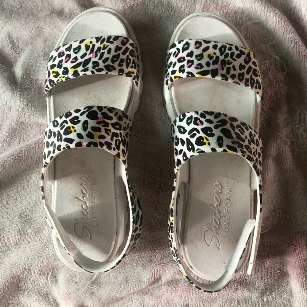 Skechers sandals.  Worn once.  Size 8 Non-smoking house.  Velcro attachment.